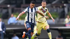 Maximiliano Meza y Guido Rodriguez disputan un balón