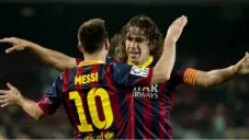 Messi y Puyol celebrando una anotación