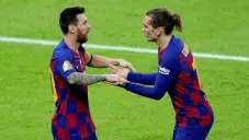 Messi y Griezmann durante un partido con Barcelona