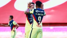 Viñas y Martínez en un juego de América