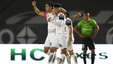 Jugadores de Atlas festejan una anotación