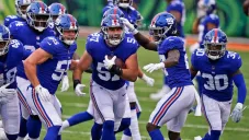 Jugadores de Giants celebran ante Bengals