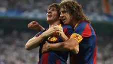 Puyol y Messi celebran una anotación del Barça