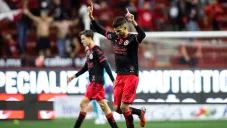 Jugadores de Xolos festejan un gol