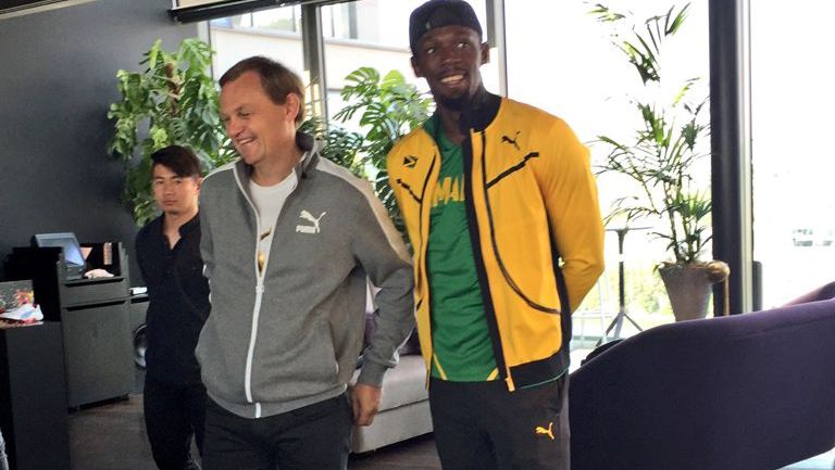 Usain Bolt junto a Bjorn Gulden, CEO de Puma