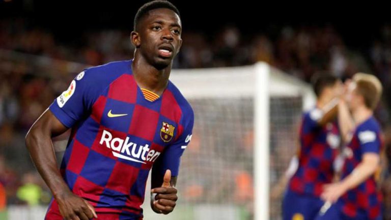 Dembélé durante un duelo con el Barcelona en España