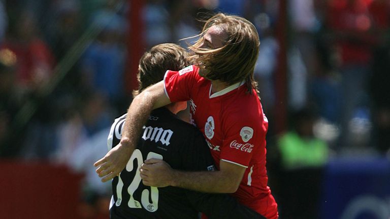 Martín Romagnoli junto a Hernán Cristante