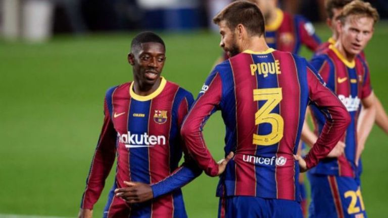 Dembélé y Piqué en un partido