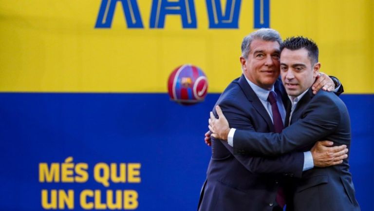 El presidente del Barcelona Joan Laporta y Xavi Hernández 